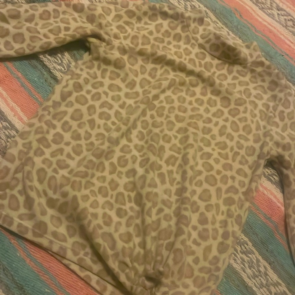 This old navy sweater is cream and tan the size is ten to a twelve